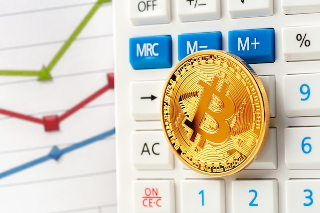 Free photo bitcoin coin and calculator