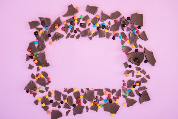 Bites of chocolate and candies in shape of frame