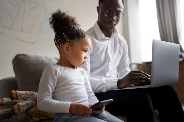 Black baby spending time with her dad