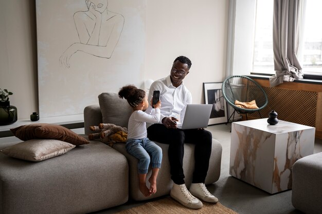 Black baby spending time with her dad