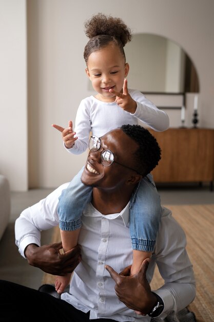 Black baby spending time with her dad