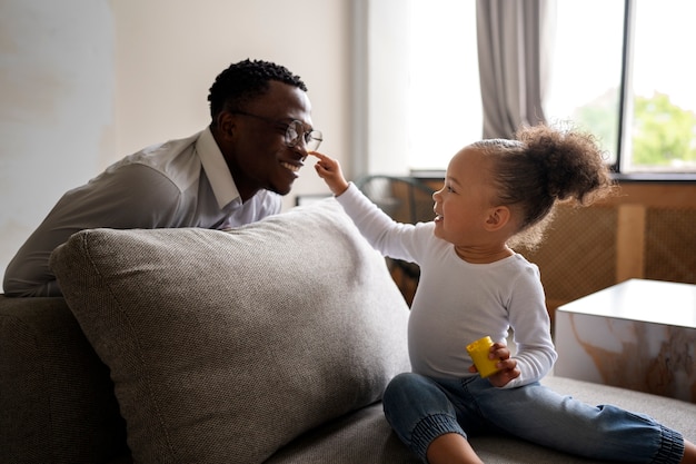 Black baby spending time with her dad