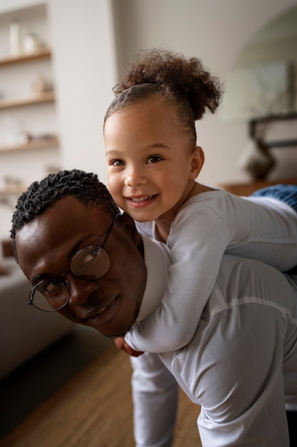 Black baby spending time with her dad