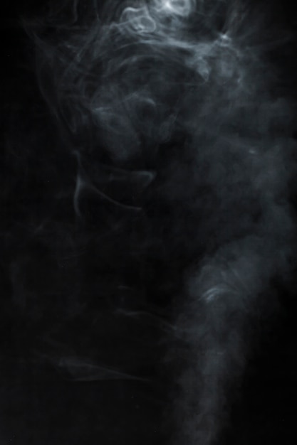 Black background with blurred smoke