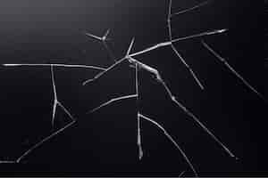 Free photo black background with cracked glass texture
