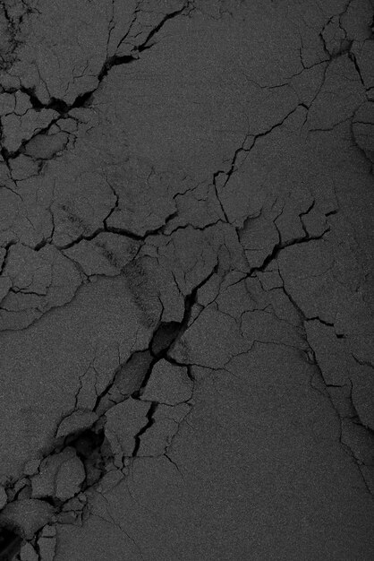 Black background with cracked sand