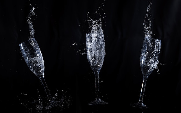 Black background with crystal glasses in motion