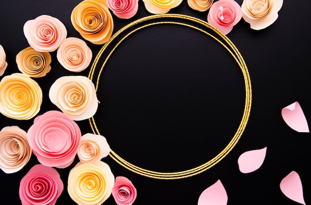 Free photo black background with cute paper flowers frame