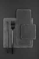 Free photo black background with cutlery