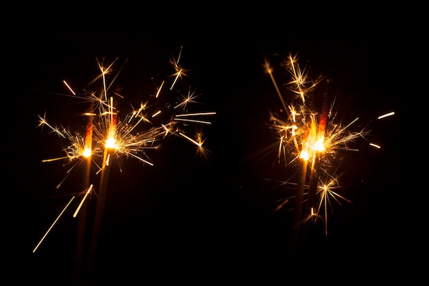 Free photo black background with fantastic sparklers