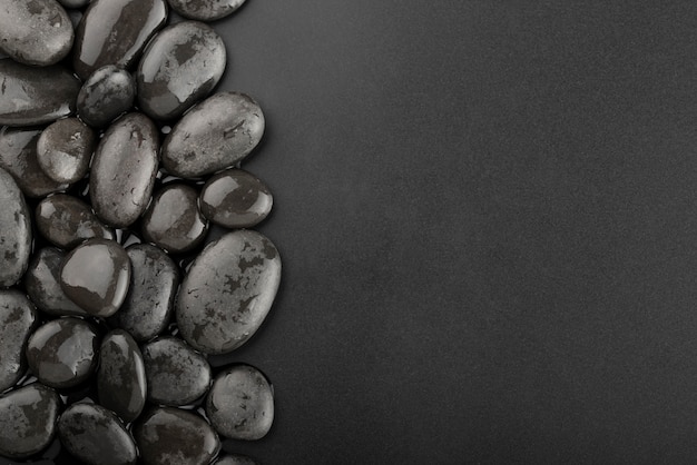 Black background with rocks and water