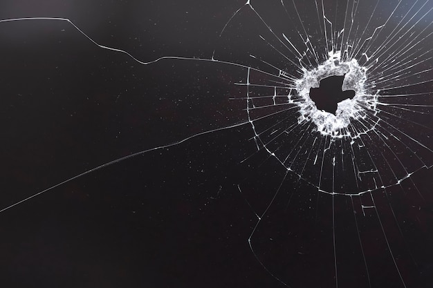 Free photo black background with shattered glass texture