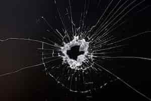 Free photo black background with shattered glass texture