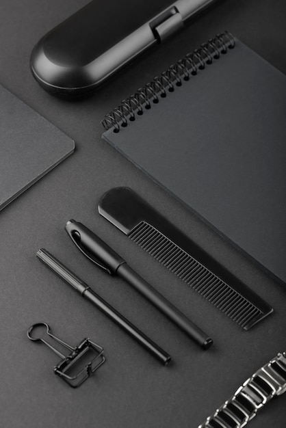 Free photo black background with stationery