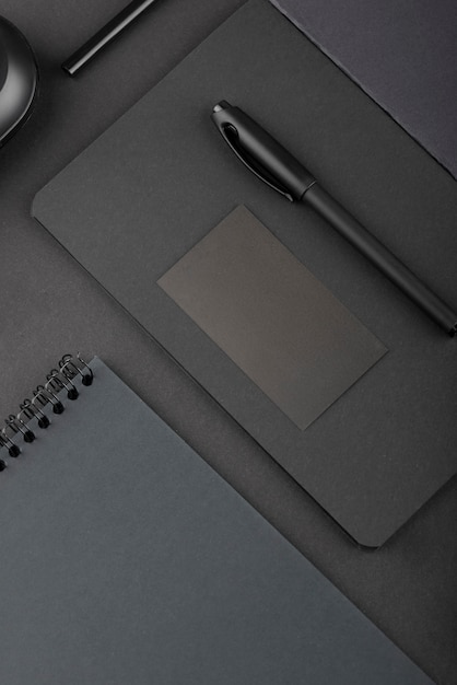 Free photo black background with stationery