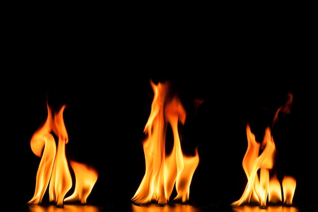 Free photo black background with three flames