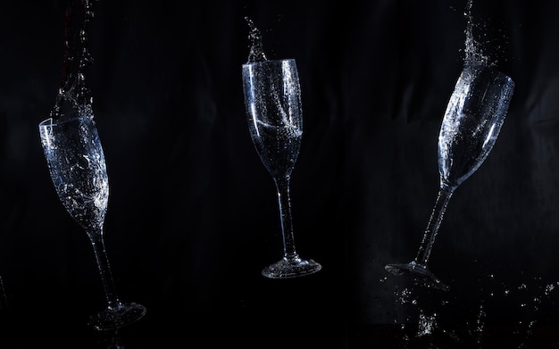 Free photo black background with three water glasses