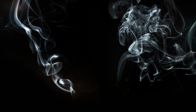 Black background with two wavy forms of smoke