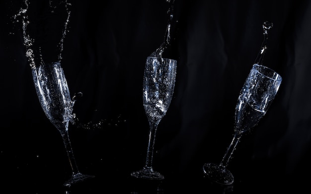 Black background with water glasses floating