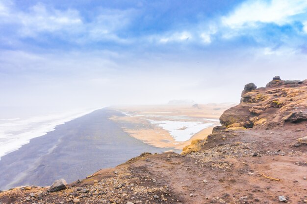 Black beach in Iceland, Winter season .