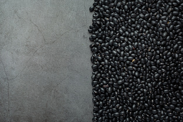 black beans and bare cement background