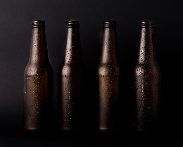 Black beer bottles line