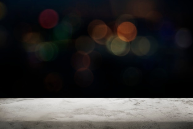 Black bokeh background with white marble floor