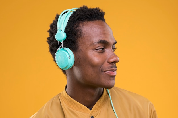 Free photo black boy posing with headphones