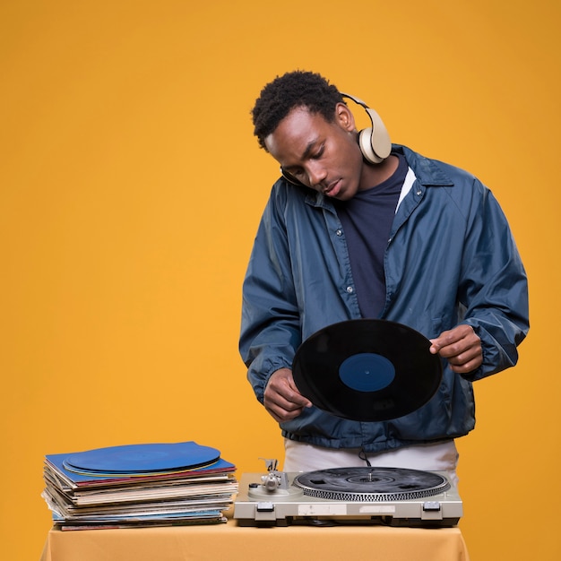 Free photo black boy posing with headphones