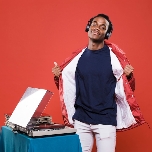 Free photo black boy posing with headphones