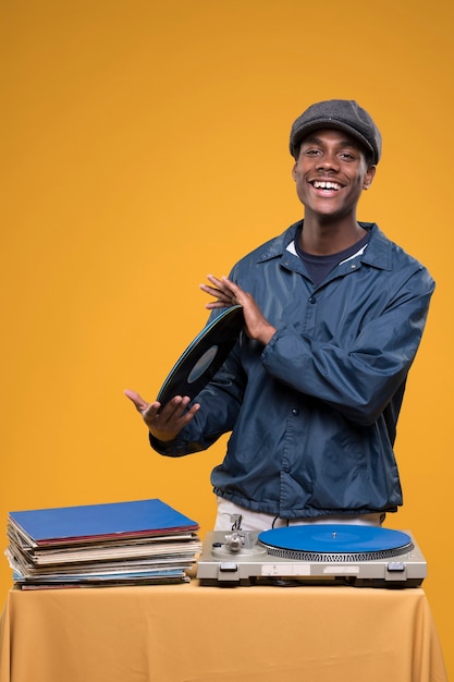 Black boy posing with vinyls