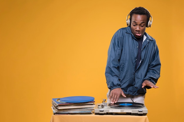 Black boy posing with vinyls