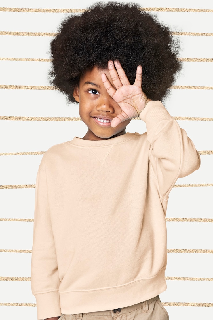 Free Photo black boy wearing cream sweater