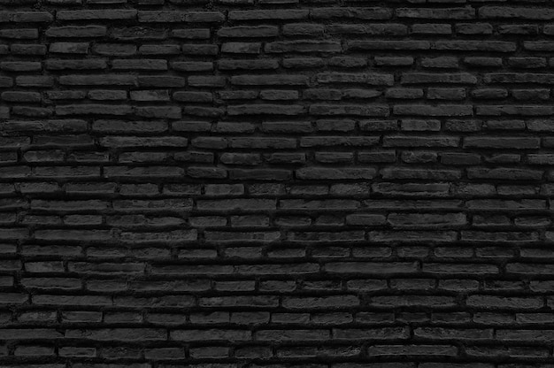 Free photo black brick wall background