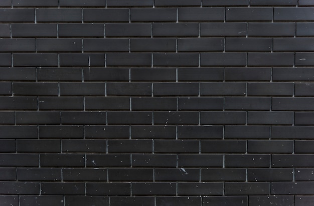 Free photo black brick wall design space