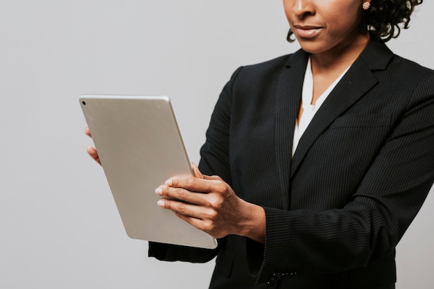 Black businesswoman using a digital tablet