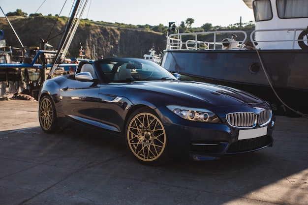 Free photo black cabriolet parked at the port.