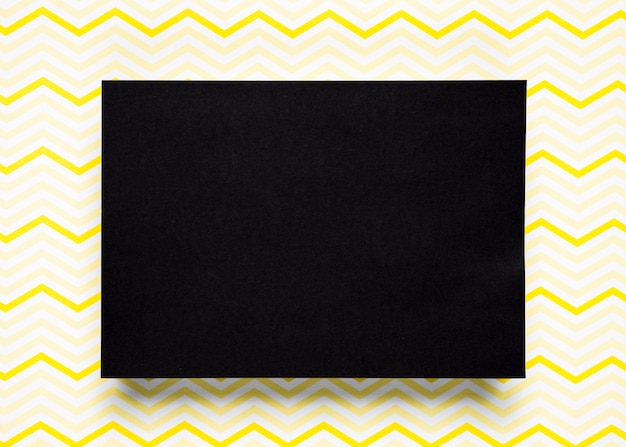 Free photo black cardboard with pattern background