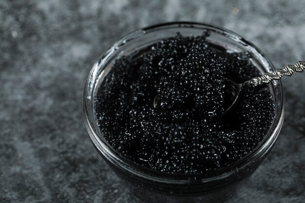 Black caviar in a glass jar