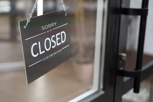 Black closed sign hanging