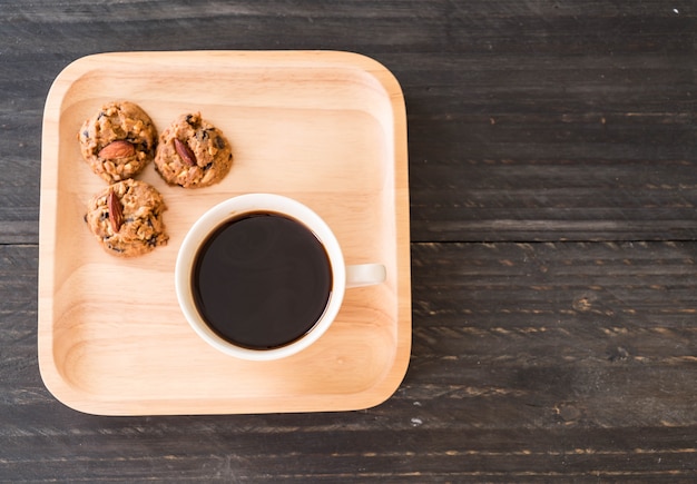 Free photo black coffee with cookies