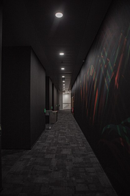 Black corridor with white lights