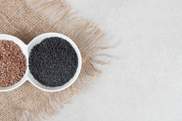 Free photo black cumin spices isolated on concrete.