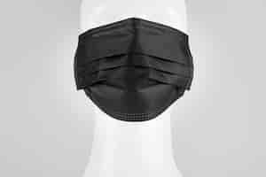 Free photo black disposable medical face mask on a mannequin