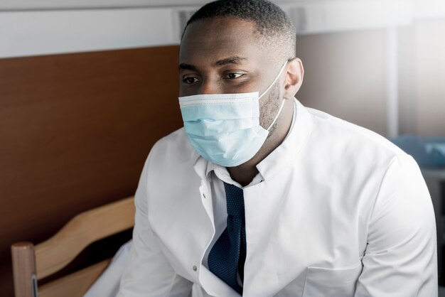 Black doctor wearing mask