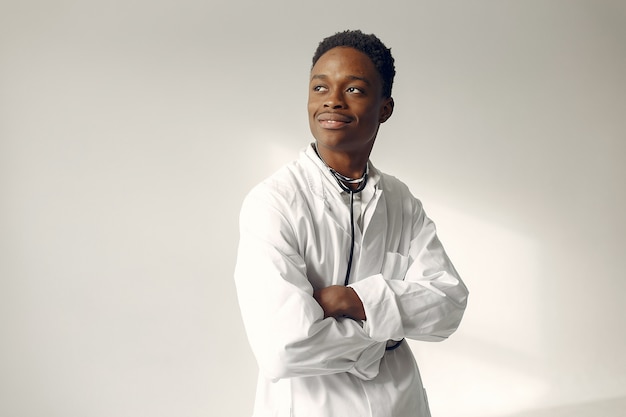 Free photo black doctor in a white uniform with a stethoscope