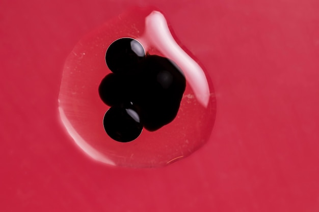 Black dot trapped in a water drop