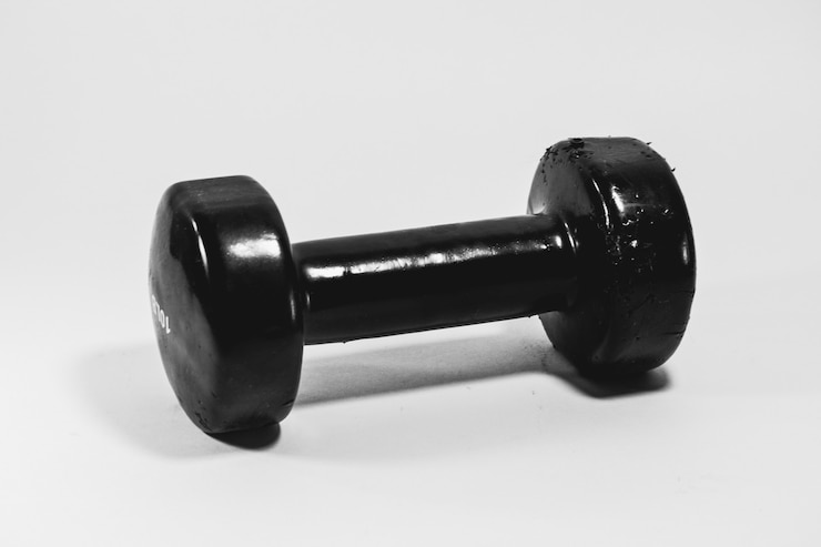 Free Photo black dumbbell isolated on a white background