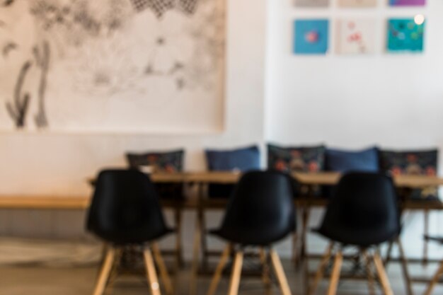 Black empty chairs and table in the coffee shop