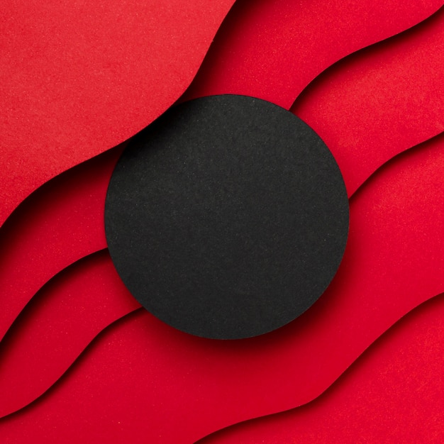 Black empty circle and wavy layers of red background